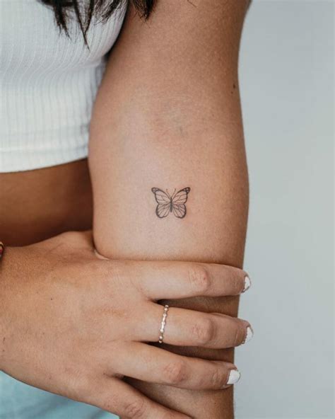 small butterfly tattoo|small butterfly tattoo on face.